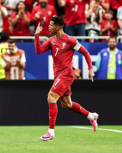 Cristiano Ronaldo gestures to the crowd in Portugal kit